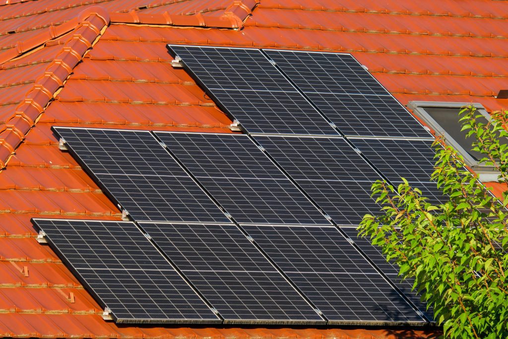 pexels-photo-17965455-17965455 Close-up of solar panels on a red tiled roof in Croatia, highlighting renewable energy.